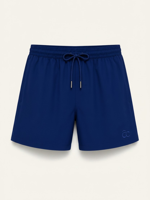 CÔTE CHIC Monaco Blue men's swim shorts in navy, quick-dry fabric with hidden pocket, flat lay